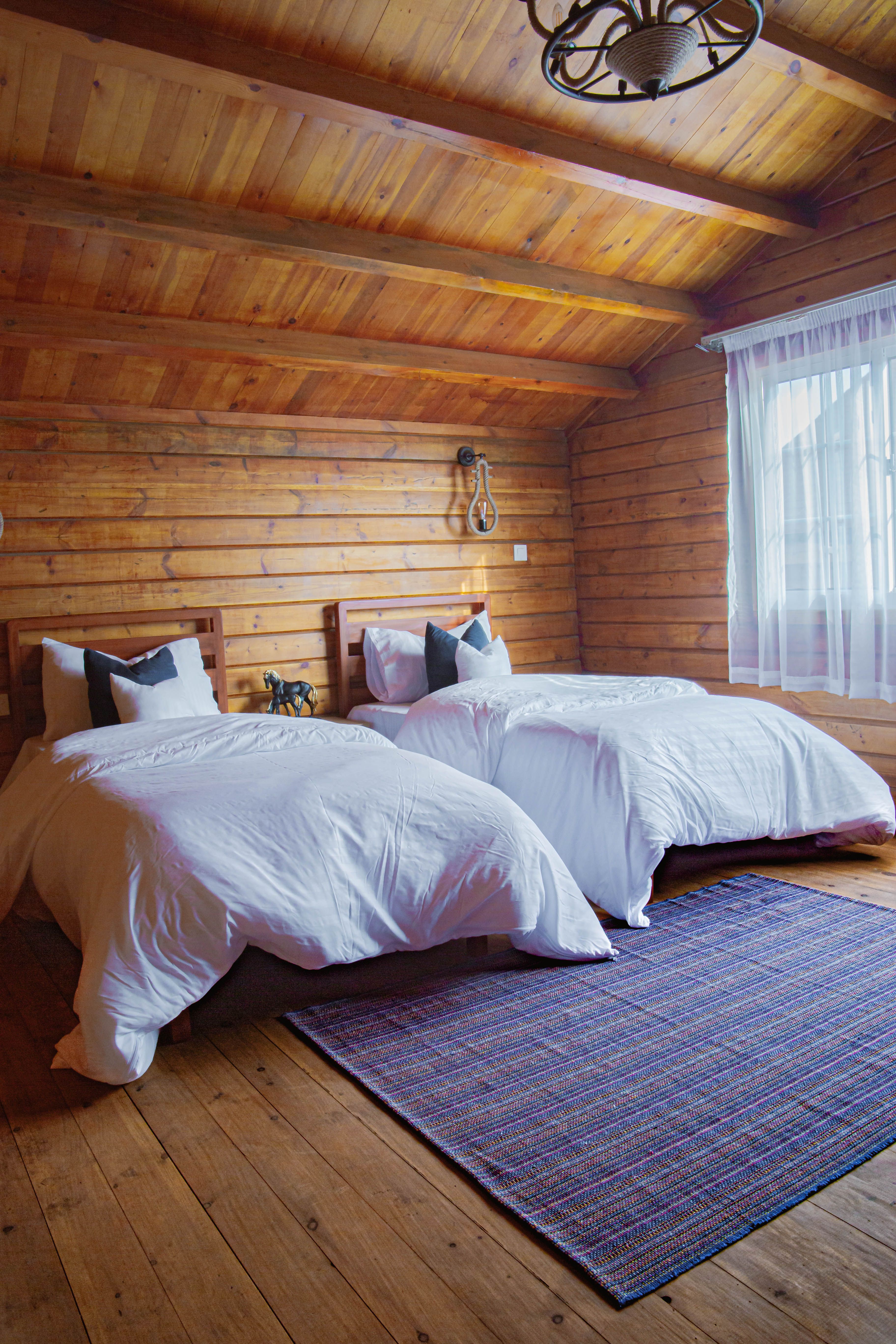 Hotel beds made up with crisp white sheets