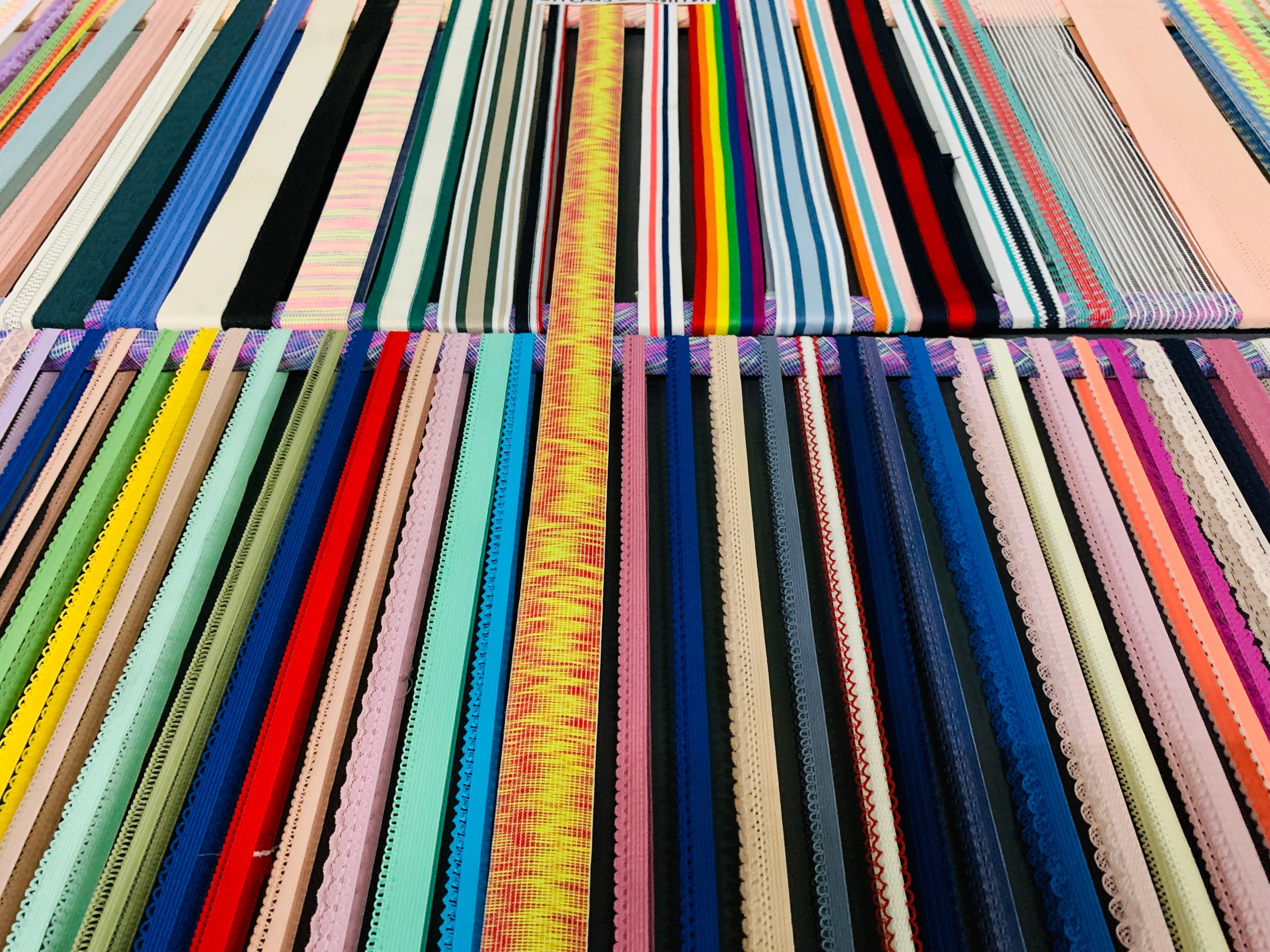 Rolls of knitted fabric stored at the mill